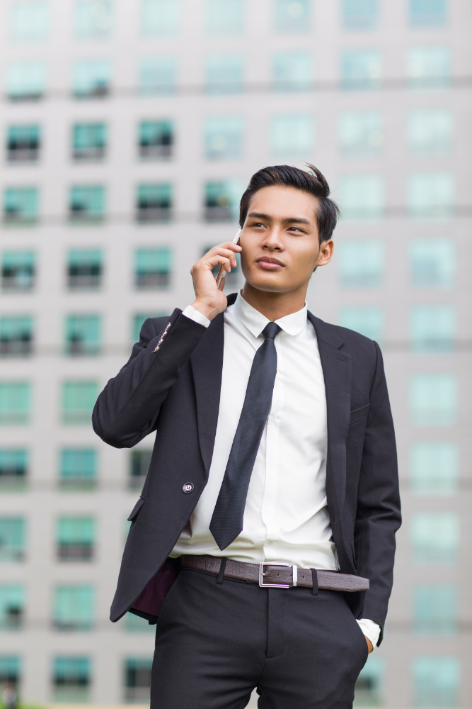 asian-business-man-calling-phone-outside